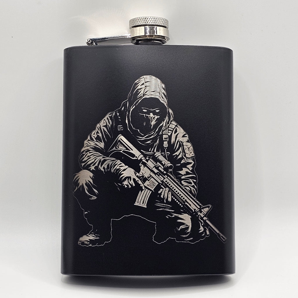 Black flask with engraved design of a person in tactical gear holding a rifle