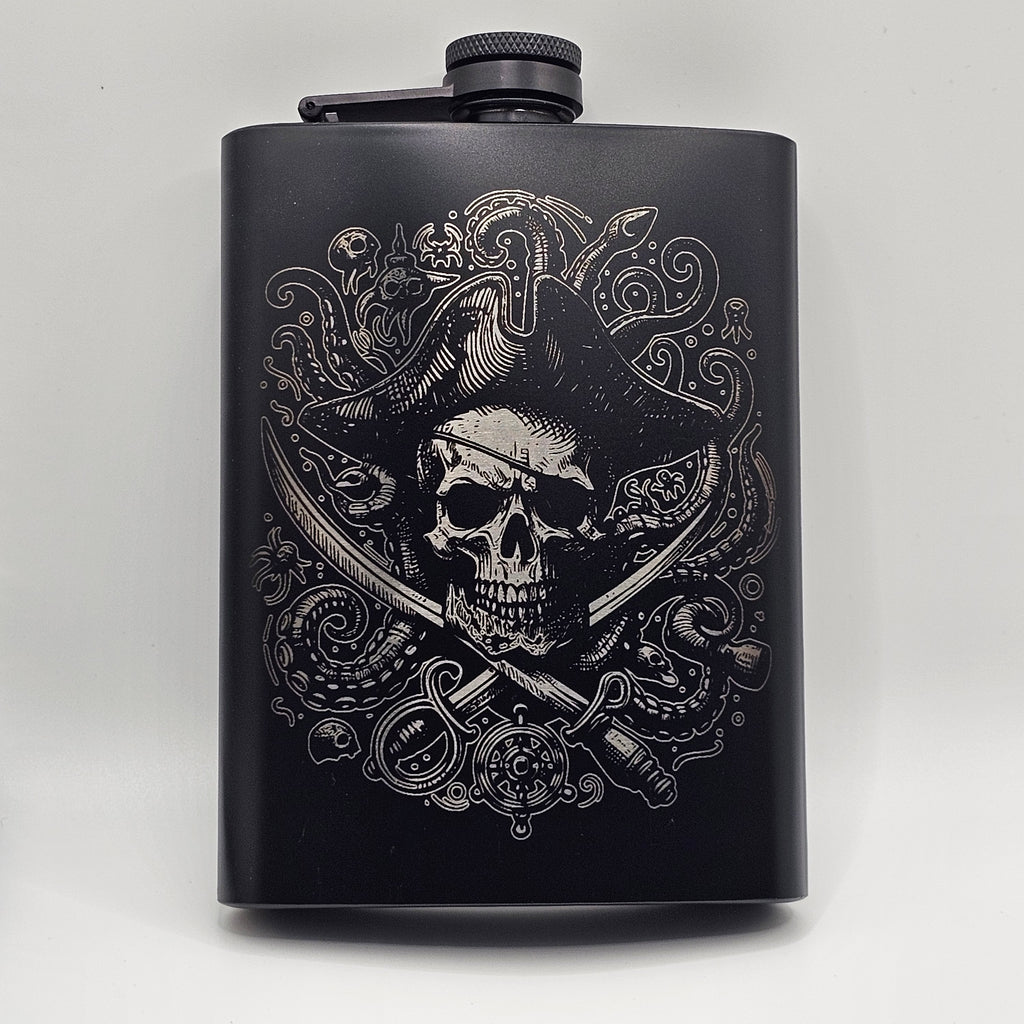 Black flask with intricate white skull and swords design on a light gray background
