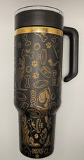 Black tumbler with gold animal-themed design on a white background