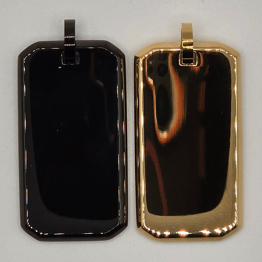Gold and black rectangular metal tag on a gray background