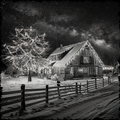 Log cabin at night with starry sky and snow-covered ground