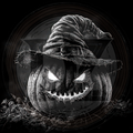 Black and white image of a carved pumpkin with a witch hat on a dark background