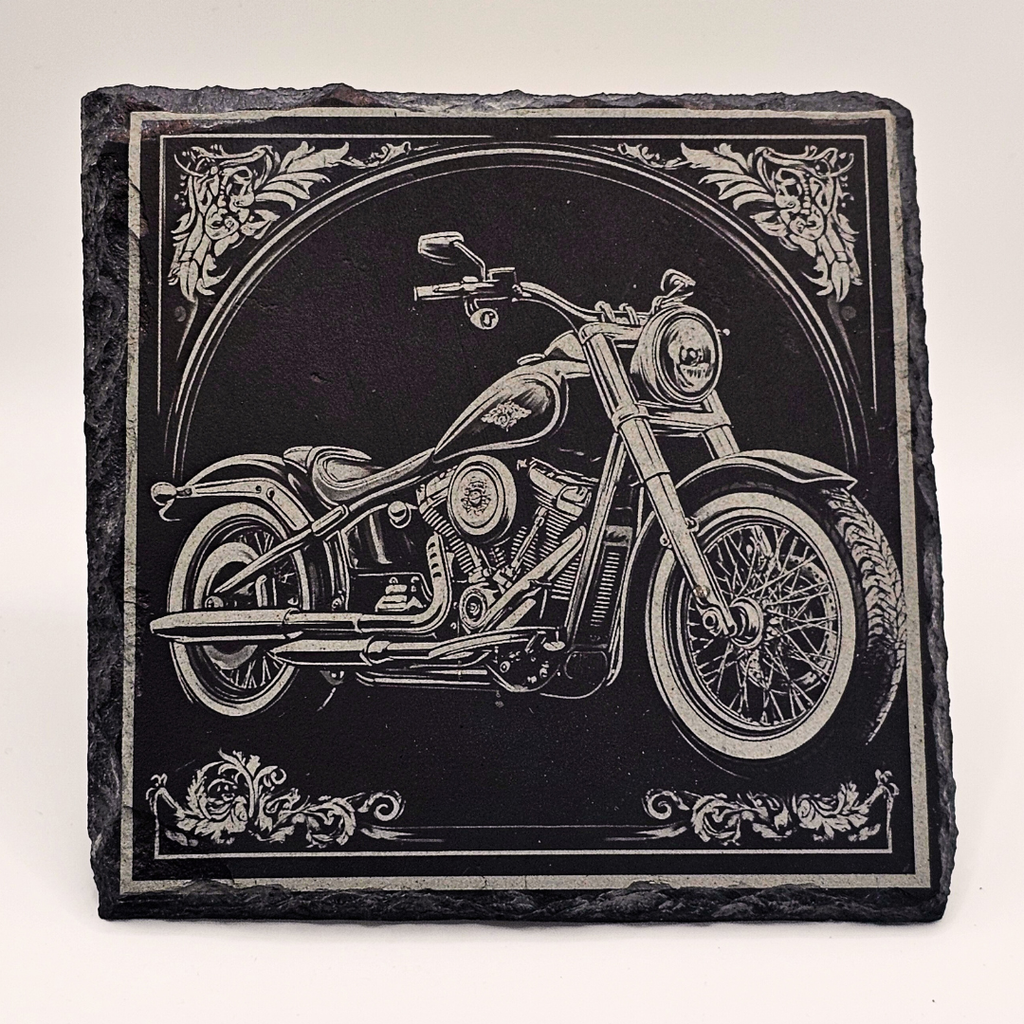 Decorative stone with a motorcycle engraving on a white background