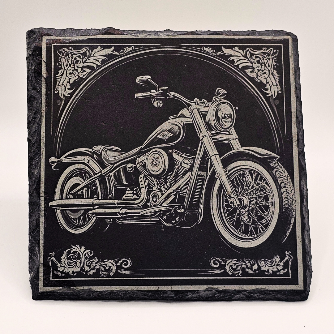 Decorative stone with a motorcycle engraving on a white background