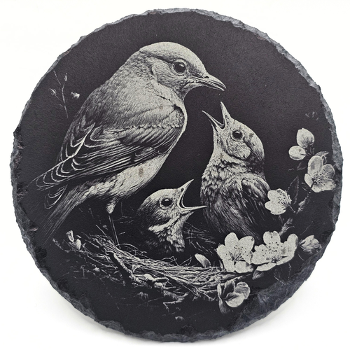 Decorative stone with engraved illustration of birds and flowers