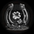 Horseshoe with a four-leaf clover and grass