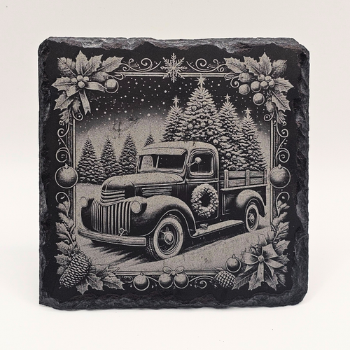Decorative stone with a vintage truck and Christmas trees design on a white background