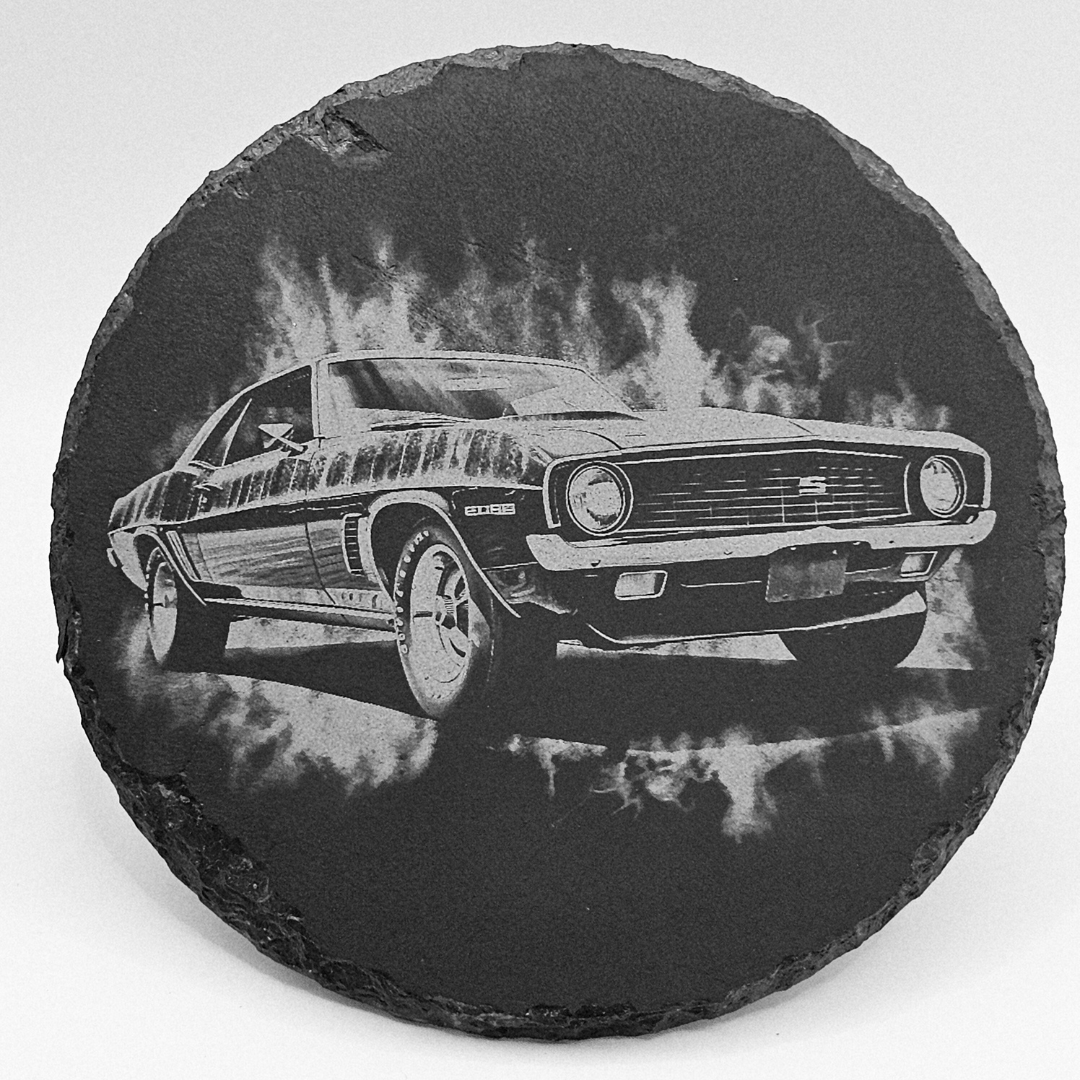 Round slate coaster with a black and white car illustration on a white background