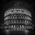 Black and white image of the Colosseum at night