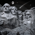 Black and white image of Mount Rushmore with a celestial background