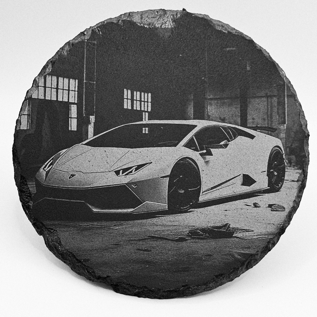 Black and white image of a sports car in an urban setting