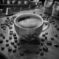 Cup of coffee with coffee beans on a wooden surface