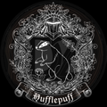 Hufflepuff crest with a badger and decorative elements on a black background