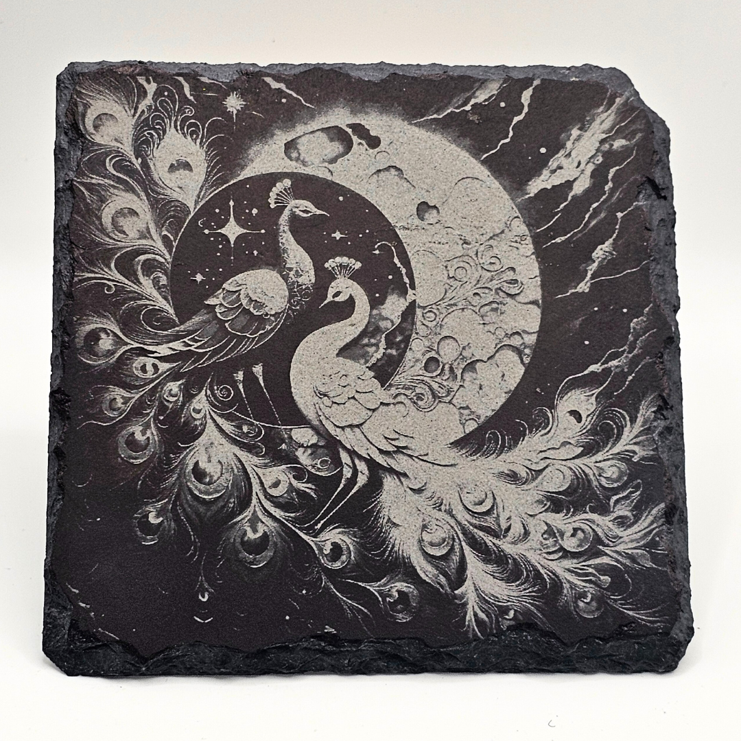 Decorative slate with peacock design and celestial elements on a white background