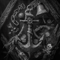 Nautical-themed decorative item with anchor, bell, and coins on a dark background