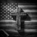 Wooden cross on a wooden American flag background