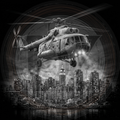 Helicopter flying over a cityscape at night