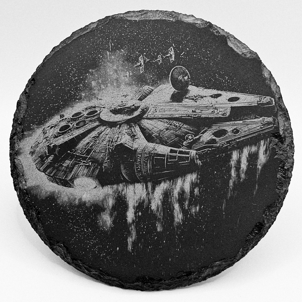 Round slate coaster with Millennium Falcon design on a white background