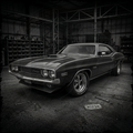 Vintage muscle car in a warehouse setting with tools on the ground.