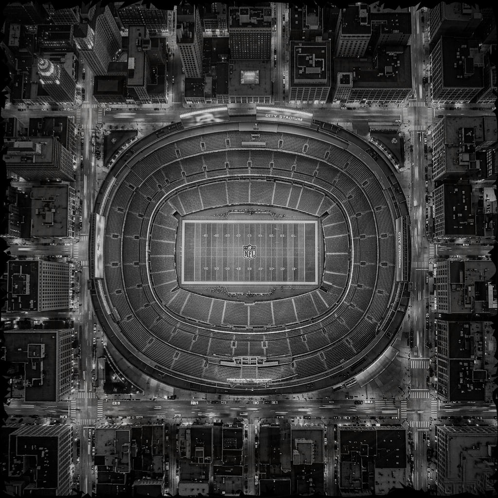 Aerial view of a football stadium at night.
