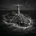 Lighthouse on a rocky island at night with a starry sky