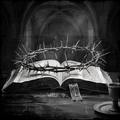 Crown of thorns on an open book with a cross, set against a dark background