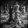 Broken chess pieces on a chessboard with a cracked king piece in the foreground.